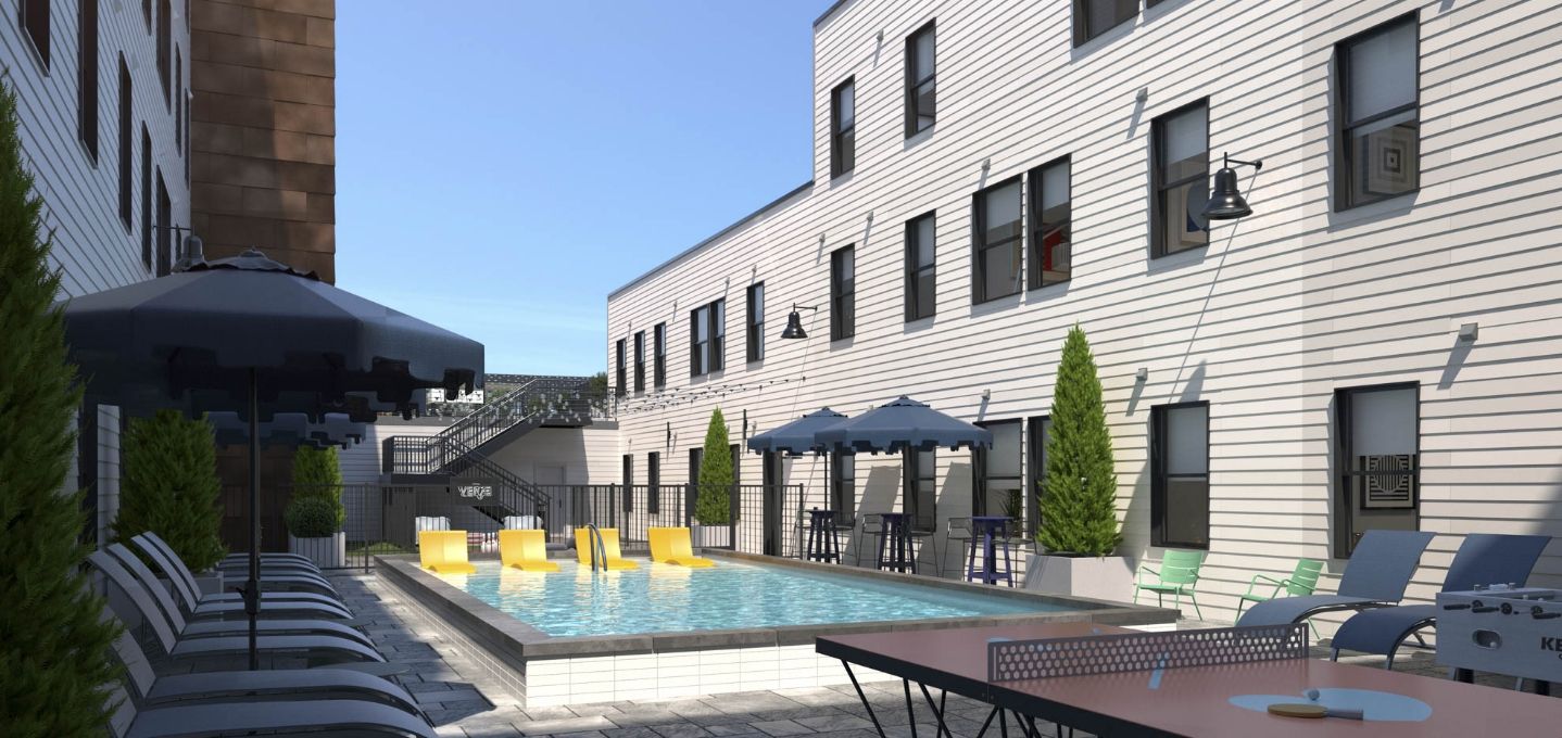 Verve Columbus luxury student apartments outdoor lounge with pool and game tables