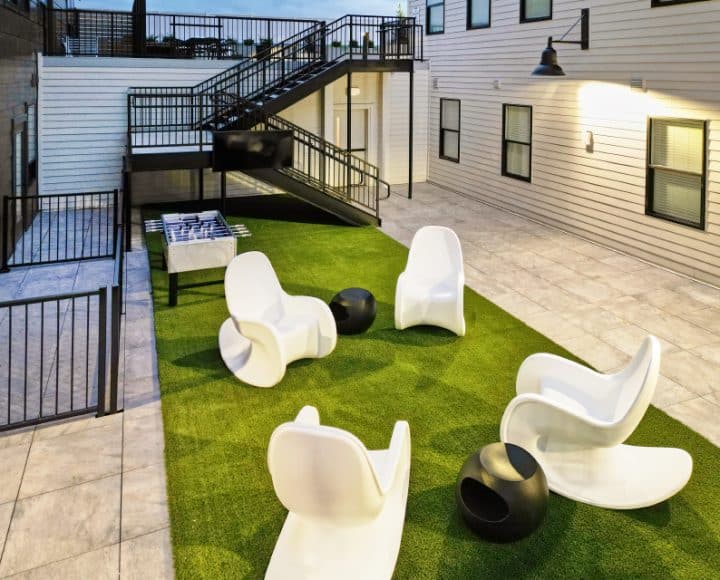 The Verve Columbus student apartments outdoor seating area with foosball table