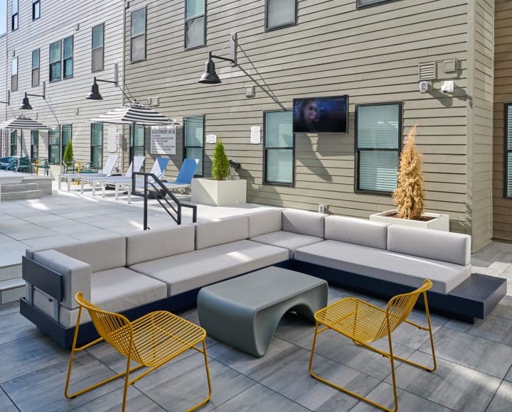 The Verve Columbus student apartments outdoor lounge area by the pool