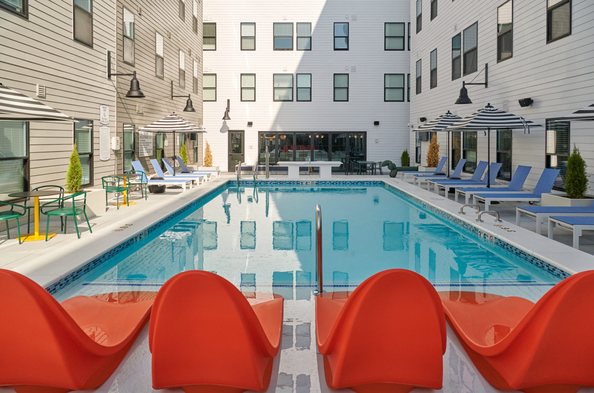 The Verve Columbus student apartments outdoor pool area with ping pong table
