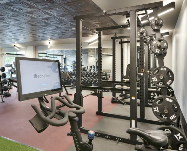 The Verve Columbus student apartments fitness center with stationary bike and weights